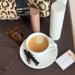 Barrette Set in Bear Hug Assorted Emi Jay hair care, accessories, and matches with coffee and purse on table.