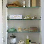 Big Effing Clip in Lemon Sugar assorted hair accessories in a medicine cabinet