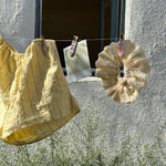 Eyelet Scrunchie in Daylily Eyelet Scrunchie in Daylily on clothesline with popstar clips