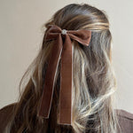 Iconic Velvet Bow Barrette in Mocha Mousse Closeup of model wearing Iconic Velvet Bow Barrette in Mocha in hair.