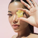 Midi Blossom Clip in Yuzu model holding Midi Blossom Clip in Yuzu