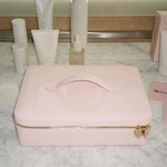 On The Way Vanity Case On The Way Vanity Case on marble counter with assorted emi jay hair care and mirror