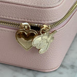 On The Way Vanity Case closeup view of charms on On The Way Vanity Case zipper