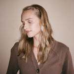 Starlet Headband in Curved Amber Model wearing Starlet Headband in Curved Amber in hair.