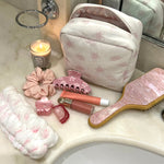 Sugar Blossom Pouch in Milk Sugar Blossom Pouch in Milk on counter with other Emi Jay products