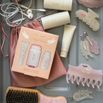 Angel Essentials Hairstyling Set Angel Essentials Kit with assorted hair care, accessories, and headphones in a plastic tray