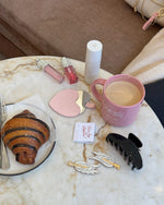 assorted Emi Jay at Sephora gift with purchase products on a table with pastry