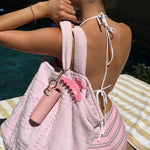 Aura Hair + Body Mist™ Keychain model with Aura Hair + Body Mist™ Keychain and big effing clip attached to purse