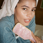 Bamboo Paddle Brush in Pink Sugar model holding Bamboo Paddle Brush in Pink Sugar