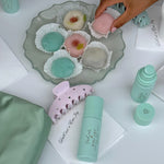 Big Effing Clip in Pink Mochi Sky Big Effing Clip in Pink Mochi Sky on table with assorted movhies and aura mists