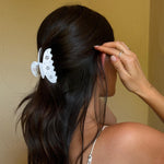 Lil Effing Clip in Blanc Petal Eyelet model touching hair while wearing Big Effing Clip in Blanc Fleur Eyelet