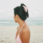 Big Effing Clip in Blush Polka Dot model on beach wearing Big Effing Clip in Blush Polka Dot in hair