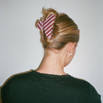 Big Effing Clip in Mulberry closeup of model wearing Big Effing Clip in Mulberry in hair