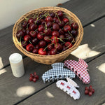 Big Effing Clip in Navy Gingham assorted gingham hair clips, angelstick, and a basket of cherries