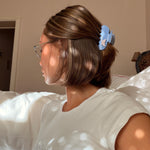 Blind Box model wearing sweetheart clip in bluebell flutter in hair