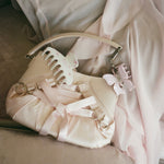 Bow Clip in Puff Pink Bow Clip in Puff Pink clipped to purse