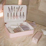 Cloud Popstar Clips in Daydream assorted emi jay hair care and accessories in vanity case next to big effing clip and angel hold on marble counter