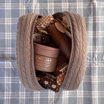 Cozy Pouch in Cookie Crumbs Knit Cozy Pouch in Cookie Crumbs Knit with assorted hair care and accessories