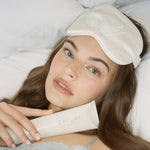 Sweet Dreams Eye Mask model wearing Sweet Dreams Eye Mask while holding Dream Crème
