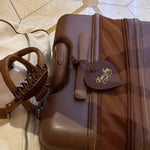 Free Gift: EJ Winter Getaway Luggage Tag winter getaway luggage tag attached to suitcase next to bag with big effing clip attached to strap