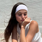 Infinity Headband in Baby Pink Gingham model with chin on hand wearing Infinity Headband in Baby Pink Gingham in hair