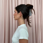 Heartbreaker Clip in Grey Smoke model in front of pink curtain wearing Heartbreaker Clip in Grey Smoke in hair