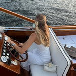 Lil Effing Clip in Buttercream model wearing Lil Effing Clip in Buttercream in hair while piloting a sea vessel