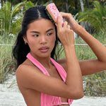 Mini Boar Bristle Brush in Lychee Baby model brushing hair with Mini Boar Bristle Brush in Lychee Baby
