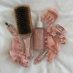Mini Boar Bristle Brush in Pink Chantilly Mini Boar Bristle Brush in Pink Chantilly with assorted hair accessories and halo hair oil