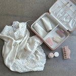 Mini Cloud Clip in Pink Smoke assorted emi jay hair care and accessories in vanity case neck to white dress