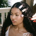 Popstar Clips in Cherry Baby model having makeup applied while wearing Popstar Clips in Cherry Baby in hair