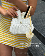 free bag charm with EJ purchases over $75 while supplies last