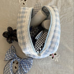 Super Bloom Clip in Blackberry Super Bloom Clip in Blackberry with assorted hair care and accessories