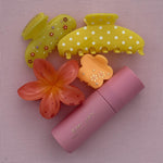 Super Bloom Clip in Peach Spritz aura hair + body mist in Lychee Baby next to emi jay hair clips