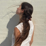 Super Bloom Clip in Tamarind model wearing Super Bloom Clip in Tamarind in hair