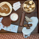Sweet Dreams Eye Mask in Dream Cloud Knit Sweet Dreams Eye Mask in Dream Cloud Knit with assorted hair care, playing cards, hot cocoa, and Emi Jay cookie