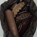Sweetheart Clip in Cozy Cabin Purse with Aura Hair Mist and assorted Emi Jay Hair Clips.