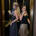 Sweetheart Clip in Dinner Party models wearing emi jay hair accessories in elevator with martinis