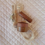 Sweetheart Clip in Cozy Cloud Gingham Sweetheart Clip in Cozy Cloud Gingham clipped to socks next to Toasted Sugar hair care products