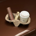 Sweetheart Clip in Vanilla Chai Aura Hair + Body Mist in Toasted Sugar, Sweetheart Clip in Vanilla Chai and coffee in a tray on a car.