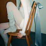 Tutu Scrunchie in Baby Blue model wearing Tutu Scrunchie in Baby Blue on wrist