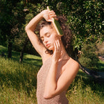 Bamboo Paddle Brush in Virgo model brushing hair with Bamboo Paddle Brush in Virgo