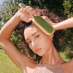 Bamboo Paddle Brush in Virgo model holding Bamboo Paddle Brush in Virgo