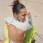 Big Effing Clip in Skate Princess Laughing while sitting and wearing Big Effing Clip in Skate Princess in hair