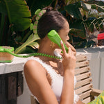 Sweetheart Clip in Green Hibiscus model on the phone while wearing 2 x Sweetheart Clip in Green Hibiscus