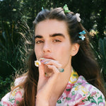 Baby Daisy Clip Set in Lychee model wearing Baby Daisy Clip Set in Lychee + Jade + Aqua