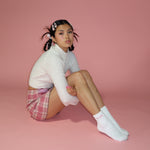 Barrette Set in Bundle Up model sitting while wearing Barrette Set in Bundle Up