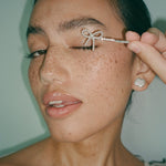 Barrette Set in Take A Bow model holding a Barrette in Take A Bow