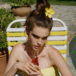 Big Daisy Clip in Sunshine model wearing Big Daisy Clip in Sunshine in hair