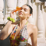 Big Effing Clip in Aries model holding Big Effing Clip in Aries